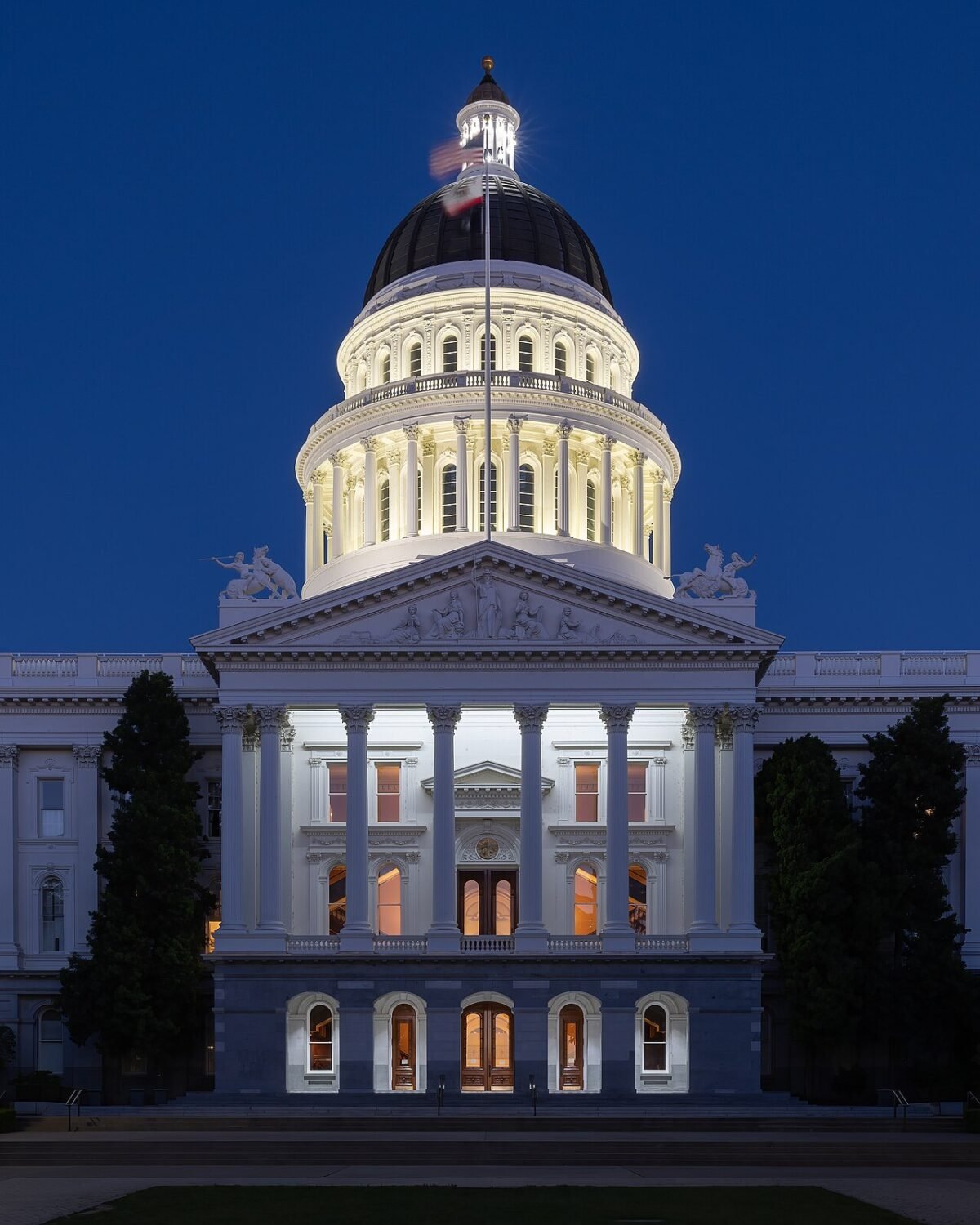 The domed California State Capitol in Sacramento lit at dusk