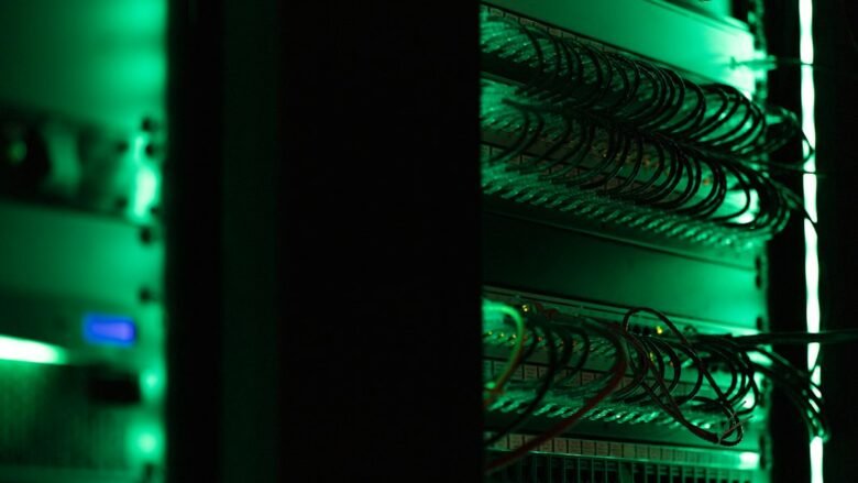 Racks of computer networking and server equipment, illustrative photograph of cyber infrastructure