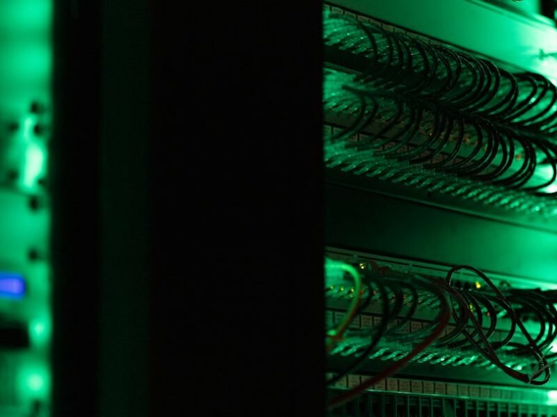 Racks of computer networking and server equipment, illustrative photograph of cyber infrastructure