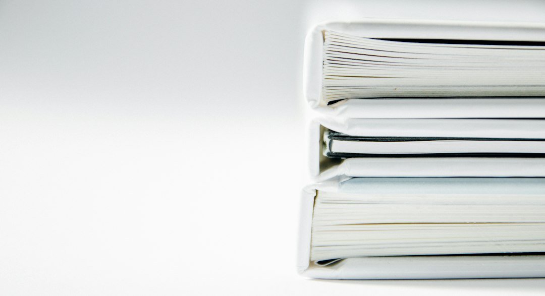 A stack of paper file folders