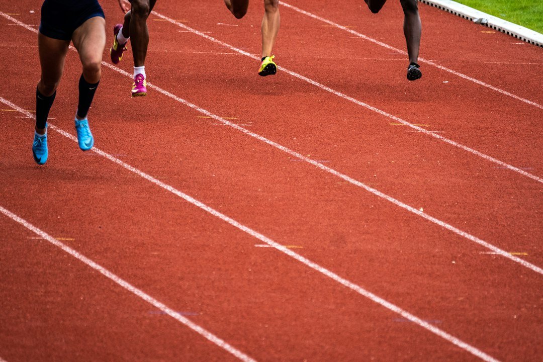 Athletes running on an outdoor track; illustrative photo